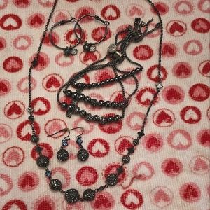 Harley Davidson necklace, bracelets, and earrings.